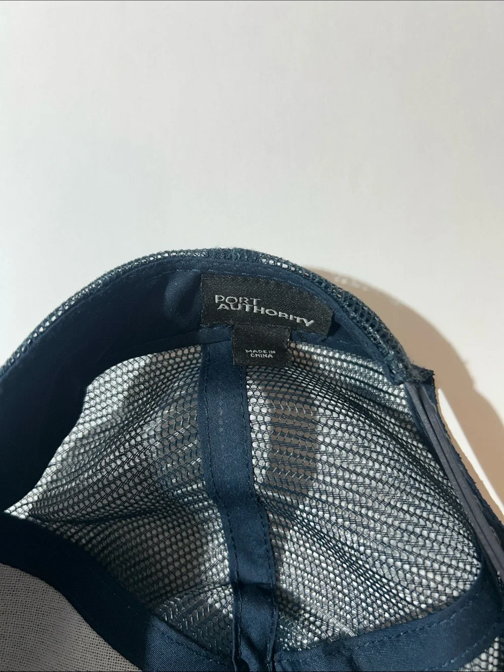 Port Authority Navy Blue Trucker Cap with White Logo